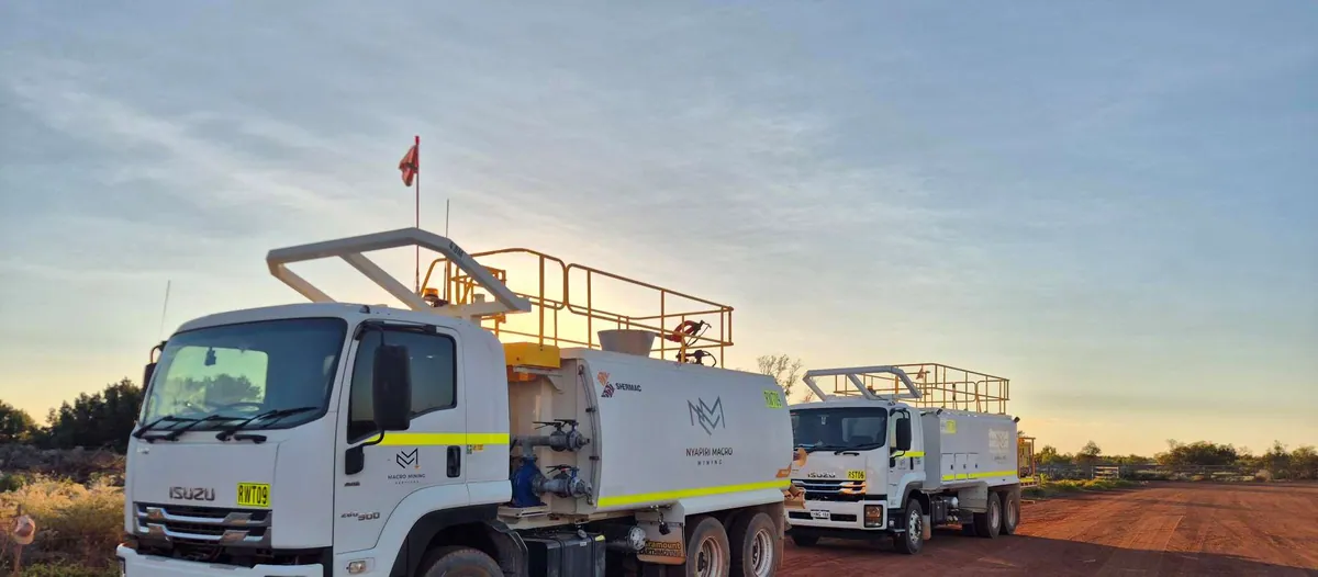 Nyapiri Macro Mining service trucks on Country performing works for BHP