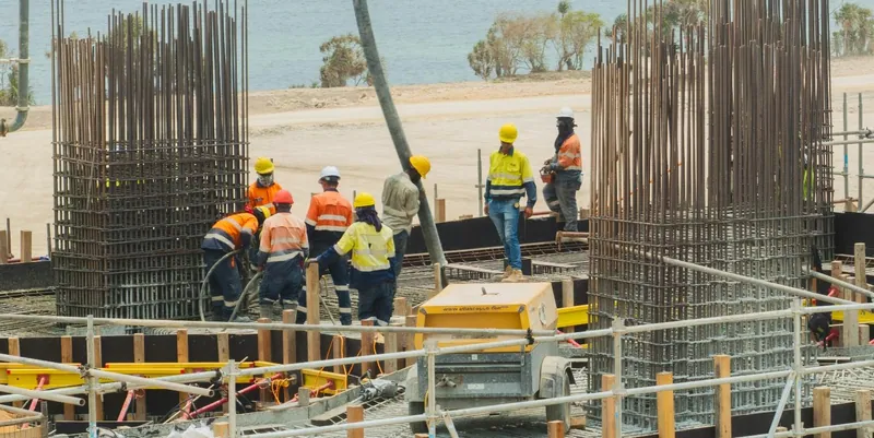 Image: PNG construction crew placing concrete on the Kiln 1 raised support deck, September 2026