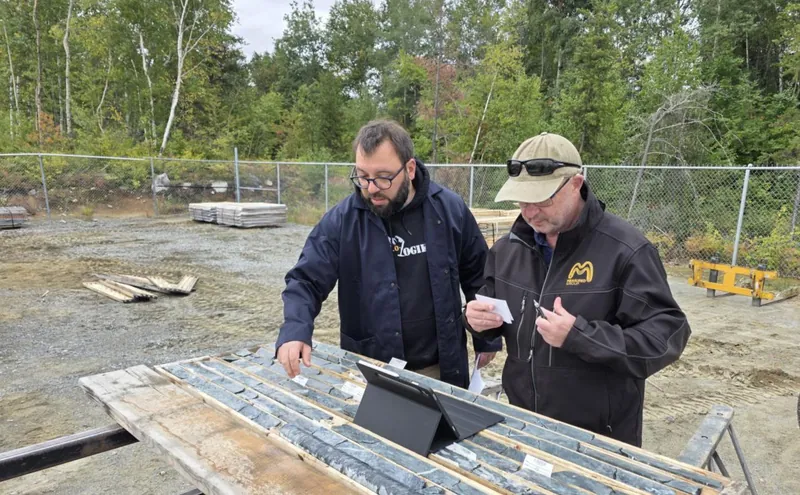 Haithem Bennia (Explo-Logik) and Lindsay Farley (Measured Group) reviewing Astoria drill core during the technical validation site visit for the Mineral Resour…