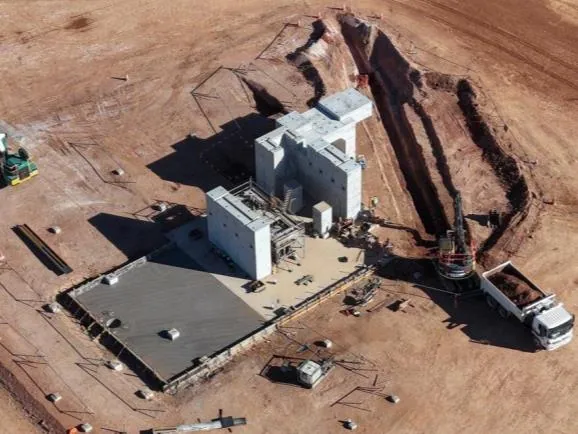 Construction activities underway (August 2026)<br><br>Top: Primary crusher (L); grinding and classification area with major concrete foundations complete (R)<b…