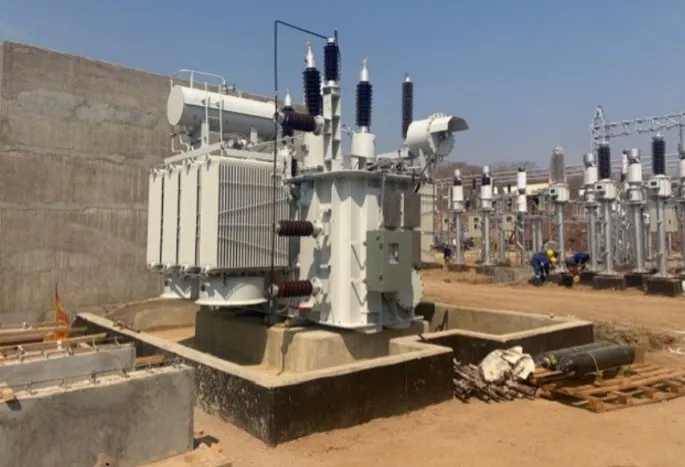 And Figure 7: Tower erection and installed transformer at Kayelekera